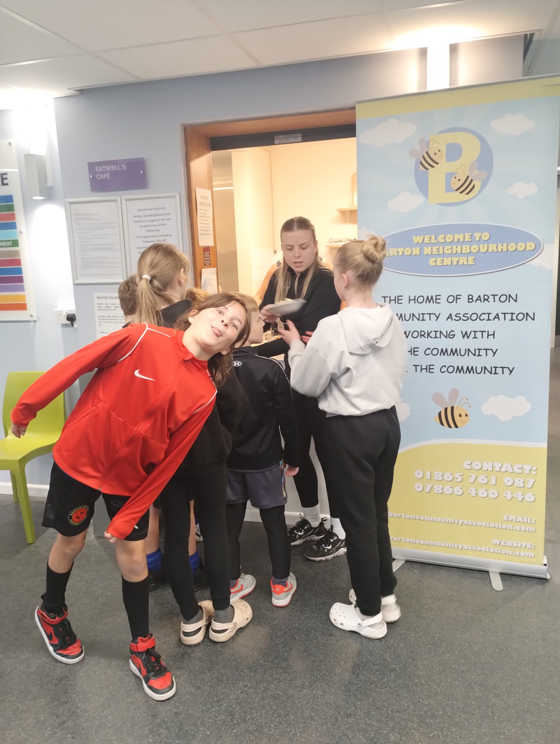 Kids pulling funny faces in front of Barton Community Centre