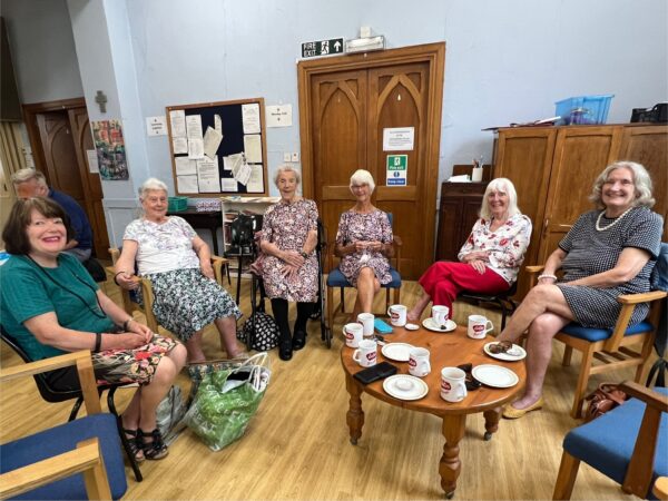 Group of people around a coffee table