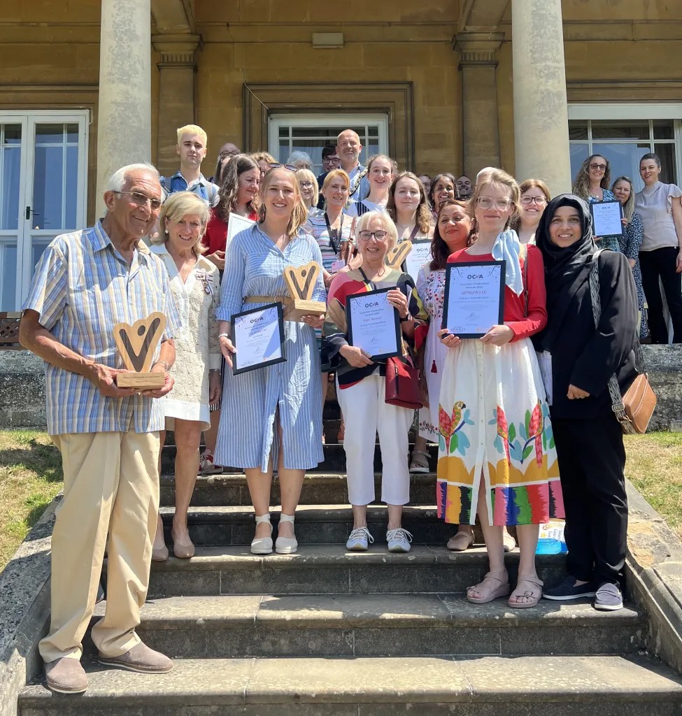 Group photo of awardees holding certificates