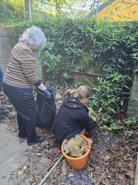 Resident and child gardening